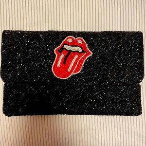 Bedazzled black clutch with Rolling Stones logo